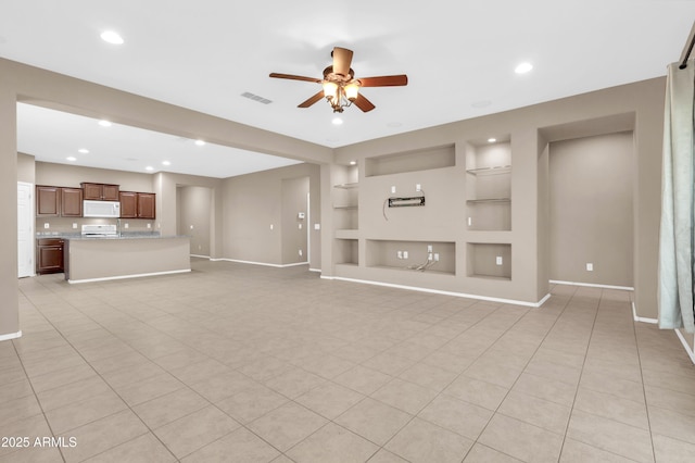 unfurnished living room with built in features, recessed lighting, baseboards, and a ceiling fan