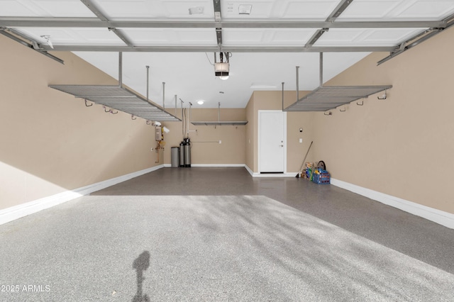 garage with baseboards and a garage door opener