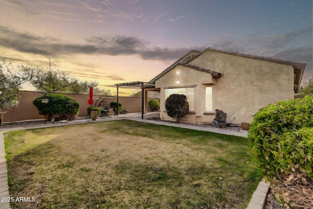 exterior space featuring a patio area, fence, and a pergola