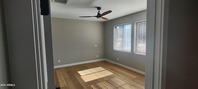 unfurnished room featuring ceiling fan and light hardwood / wood-style floors