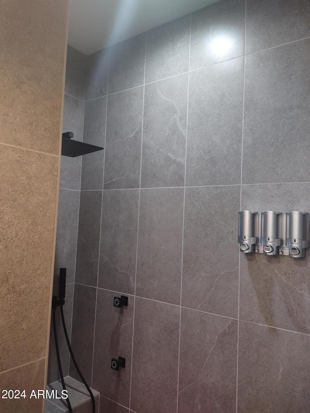 bathroom with tiled shower