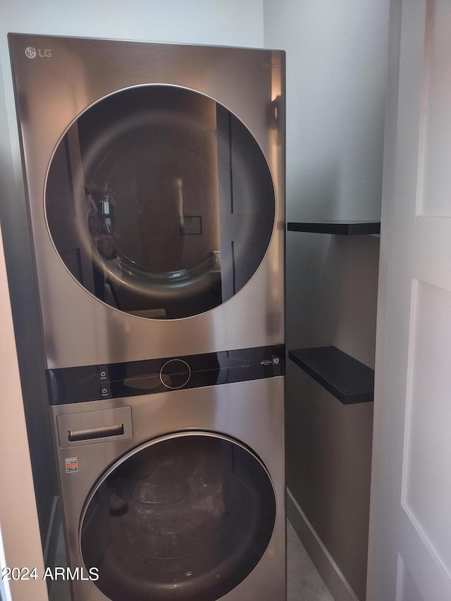 washroom with stacked washer and clothes dryer