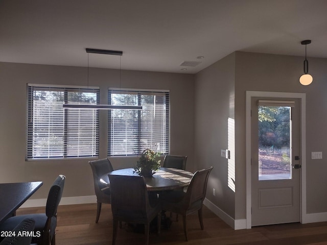 dining area with hardwood / wood-style floors