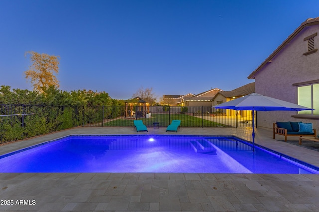 view of swimming pool featuring a patio area and fence