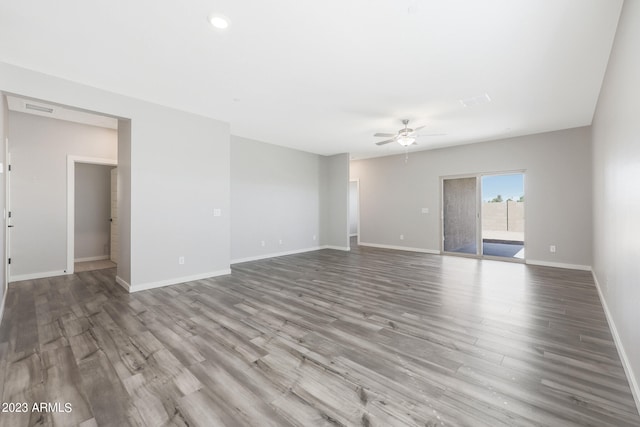 unfurnished room featuring ceiling fan and hardwood / wood-style flooring