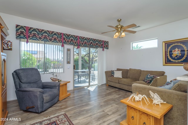 living room with wood-type flooring and ceiling fan