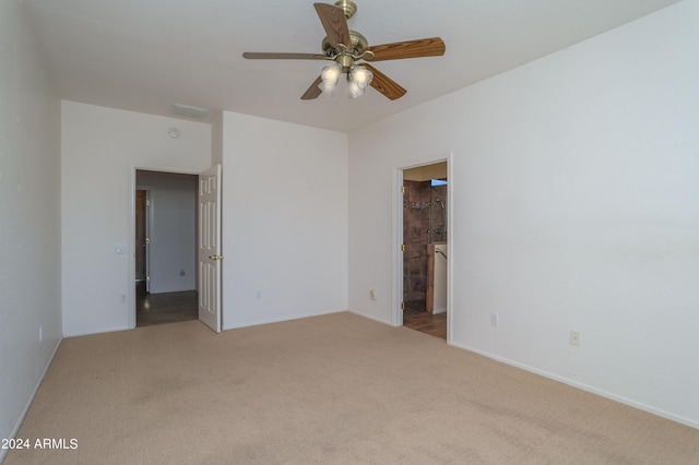 unfurnished room with light carpet and ceiling fan