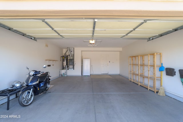 garage with a garage door opener and gas water heater