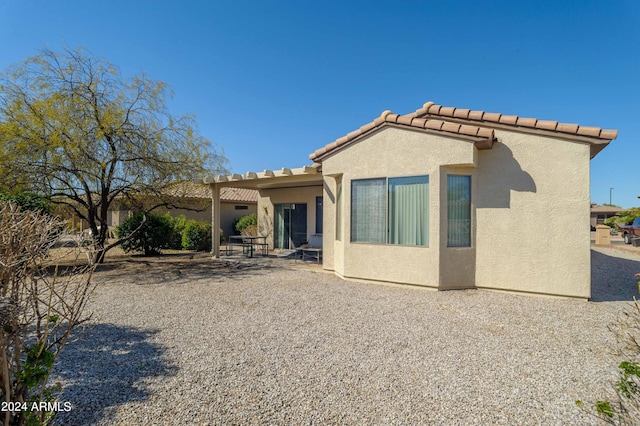 back of property featuring a patio area