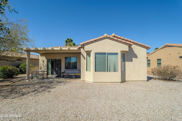 rear view of house featuring a patio area