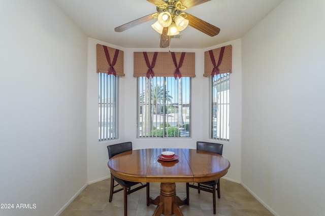 dining room featuring ceiling fan and light tile floors