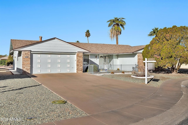 ranch-style house featuring a garage