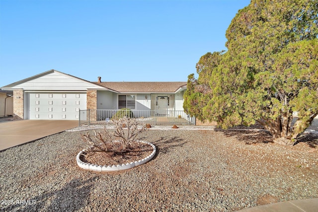 ranch-style house featuring a garage