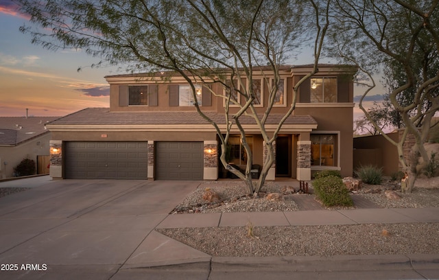 view of front of property featuring a garage