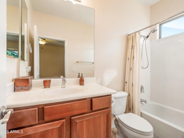 full bathroom with toilet, shower / bathtub combination with curtain, ceiling fan, and vanity