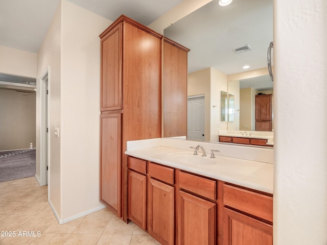 bathroom with tile patterned flooring and vanity