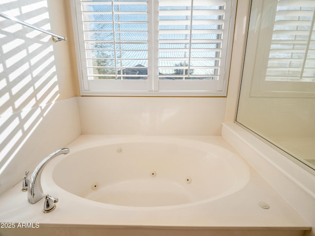 bathroom featuring a tub to relax in