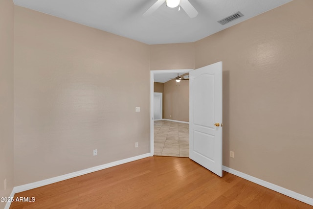 3887 E Via Del Rancho Rd, Gilbert, AZ 85298 - spare room featuring ceiling fan, light wood finished floors, and baseboards