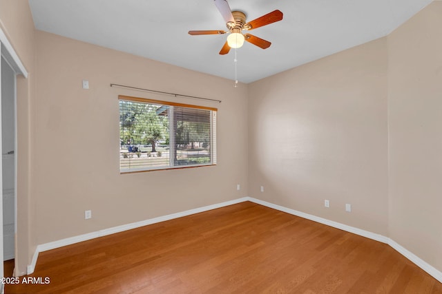 3887 E Via Del Rancho Rd, Gilbert, AZ 85298 - spare room with wood finished floors, baseboards, and a ceiling fan