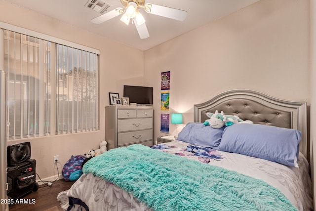 bedroom featuring ceiling fan and dark hardwood / wood-style flooring