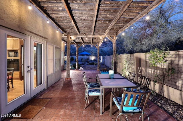 view of terrace featuring a pergola and french doors