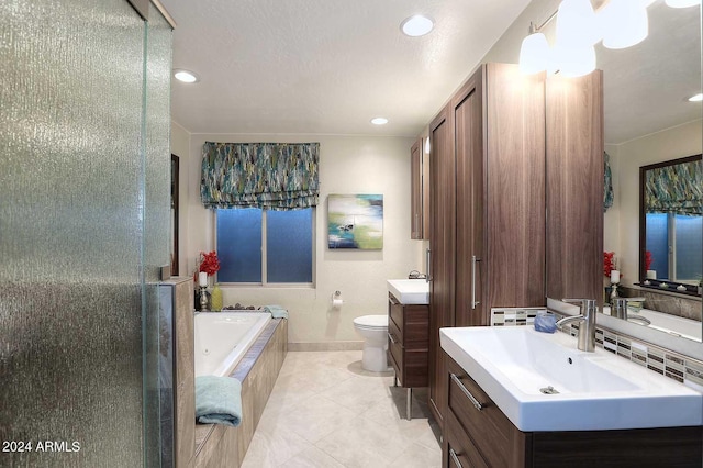 full bathroom with shower with separate bathtub, toilet, tile floors, and vanity