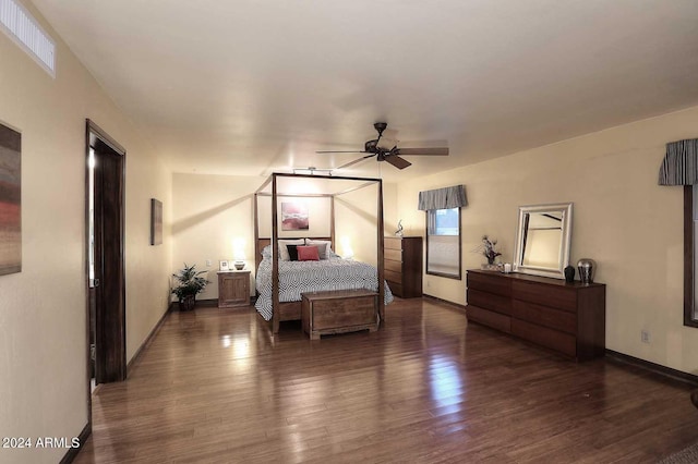 bedroom with ceiling fan and dark wood-type flooring