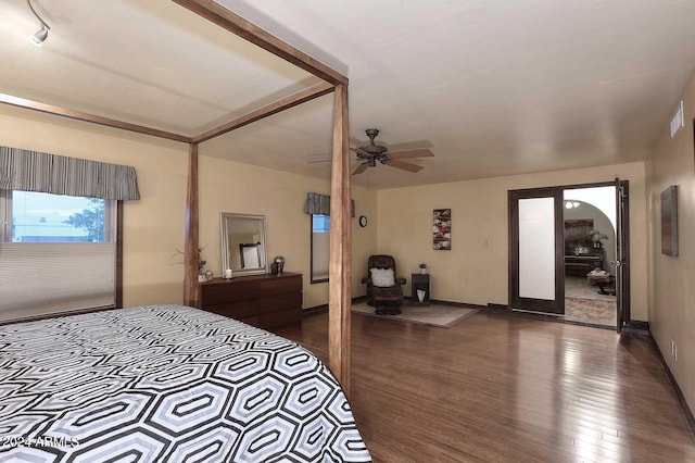 bedroom featuring a closet, ceiling fan, and dark hardwood / wood-style flooring