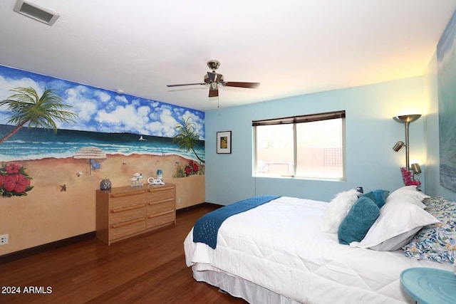 bedroom with ceiling fan and dark wood-type flooring