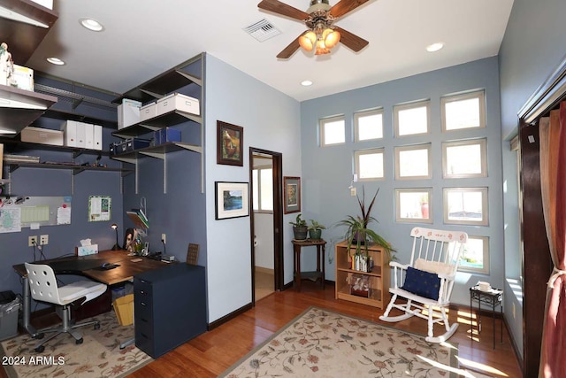 office space with ceiling fan, light wood-type flooring, and plenty of natural light