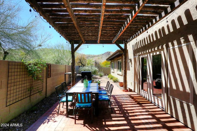 view of terrace featuring a pergola