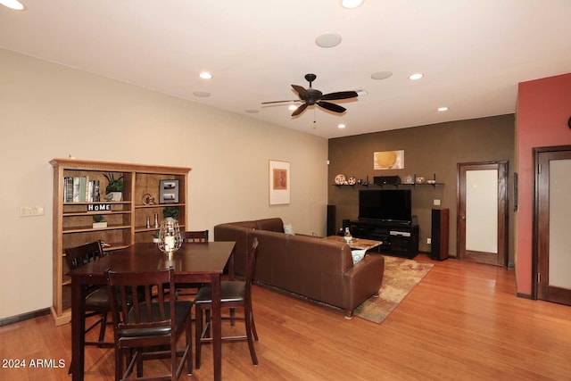 living room featuring ceiling fan and light wood-type flooring