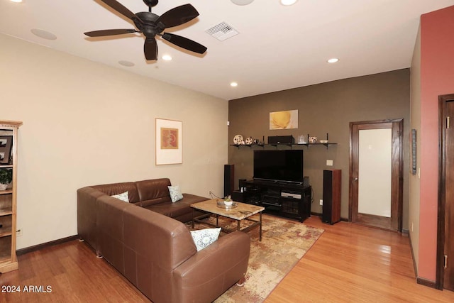 living room with ceiling fan and light wood-type flooring