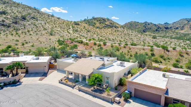 birds eye view of property featuring a mountain view