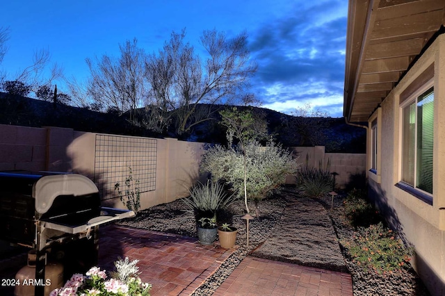 view of patio terrace at dusk