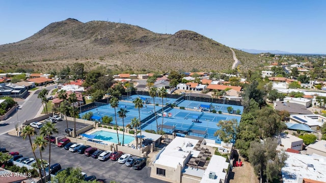 birds eye view of property with a mountain view