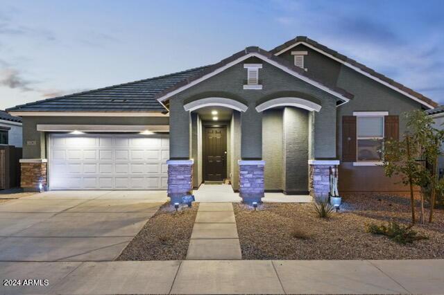 view of front of home with a garage