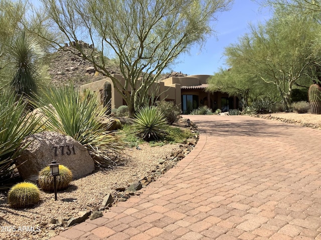 7731 E Soaring Eagle Way, Scottsdale, AZ 85266 - adobe home with decorative driveway and stucco siding