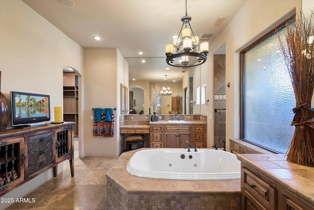 7731 E Soaring Eagle Way, Scottsdale, AZ 85266 - full bath featuring a chandelier, a whirlpool tub, vanity, and recessed lighting