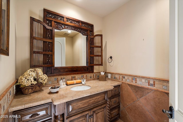 7731 E Soaring Eagle Way, Scottsdale, AZ 85266 - bathroom with vanity and decorative backsplash