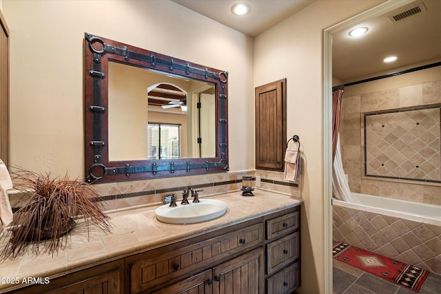 7731 E Soaring Eagle Way, Scottsdale, AZ 85266 - full bath featuring vanity, tiled shower / bath combo, recessed lighting, and tasteful backsplash
