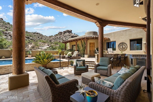 7731 E Soaring Eagle Way, Scottsdale, AZ 85266 - view of patio featuring an outdoor living space and a mountain view