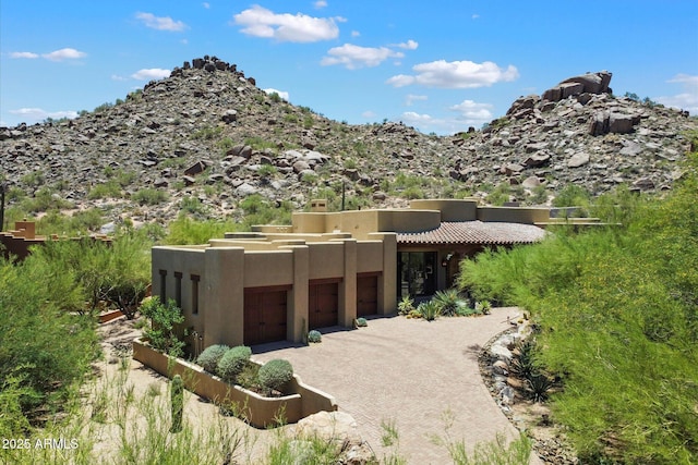7731 E Soaring Eagle Way, Scottsdale, AZ 85266 - view of front of property with stucco siding and an attached garage