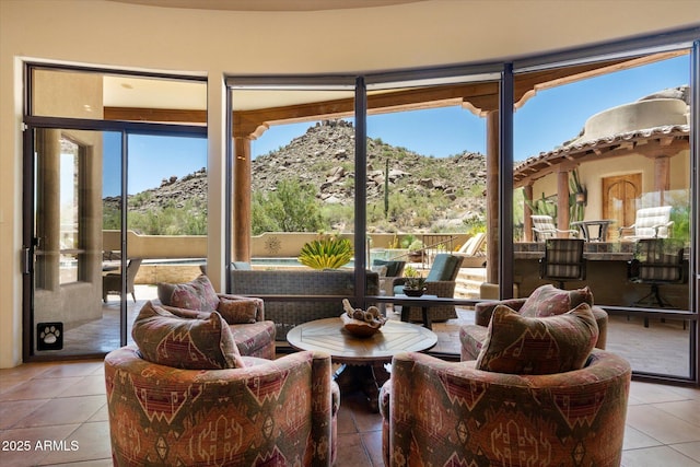 7731 E Soaring Eagle Way, Scottsdale, AZ 85266 - living room featuring light tile patterned floors and a mountain view
