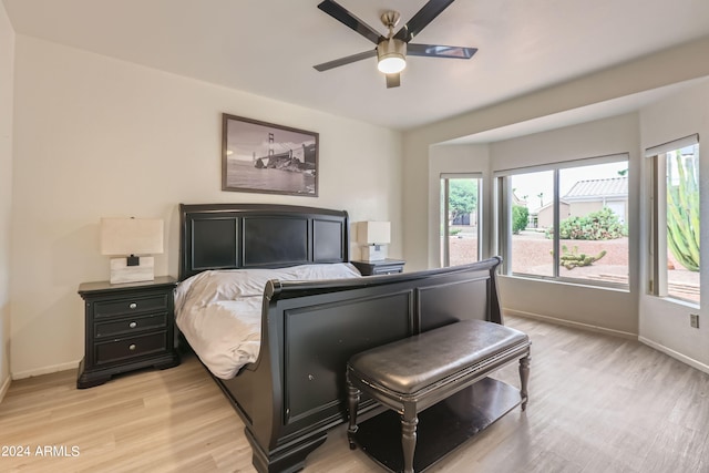 bedroom with light wood-type flooring and ceiling fan