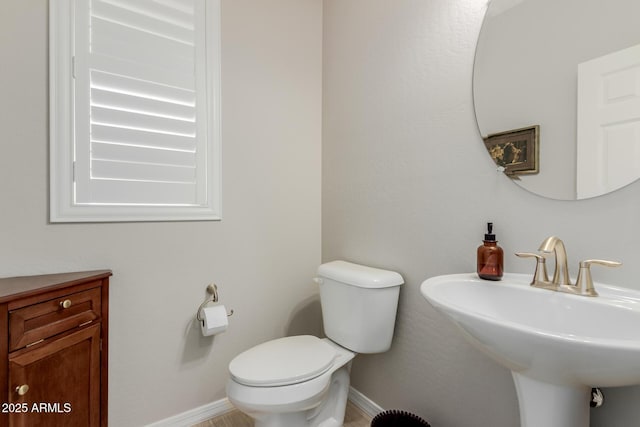 20603 W Alsap Rd, Buckeye, AZ 85396 - half bathroom with toilet, a sink, and baseboards