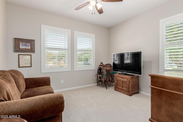 20603 W Alsap Rd, Buckeye, AZ 85396 - sitting room with healthy amount of natural light, a ceiling fan, light carpet, and baseboards