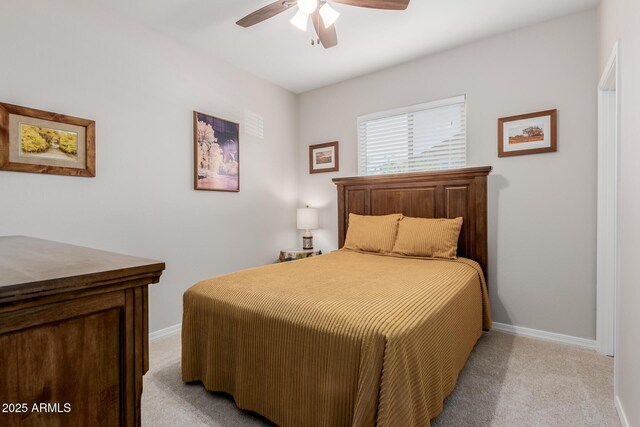 20603 W Alsap Rd, Buckeye, AZ 85396 - bedroom with light colored carpet, baseboards, and ceiling fan