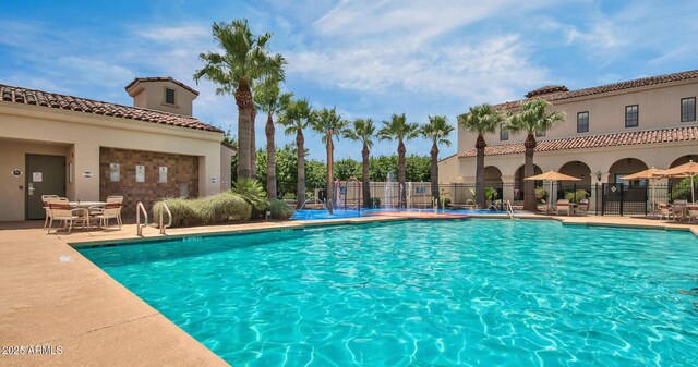 20603 W Alsap Rd, Buckeye, AZ 85396 - community pool featuring a patio