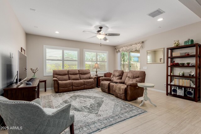 20603 W Alsap Rd, Buckeye, AZ 85396 - living room featuring ceiling fan, plenty of natural light, baseboards, and recessed lighting